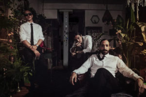 MakeWar Band promo photo dressed in suits